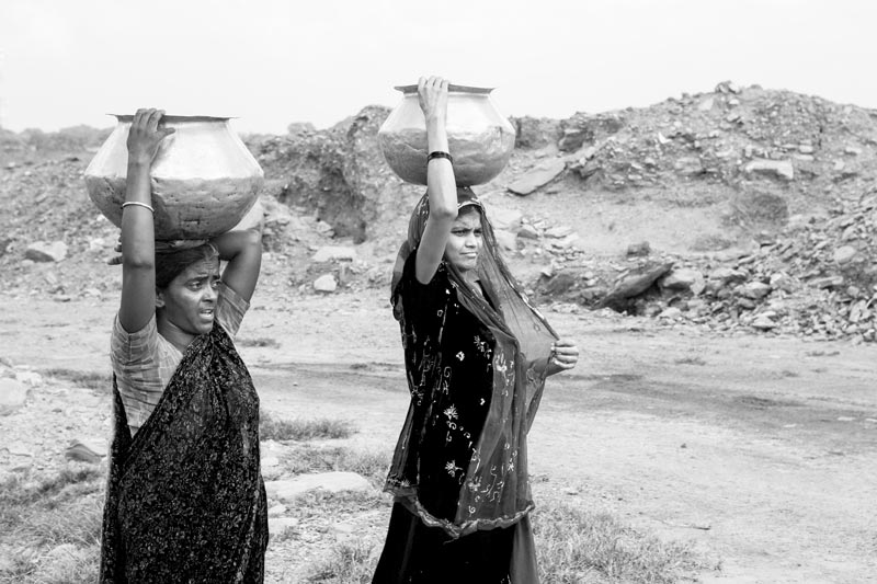 Women and Drinking Water Challenges - Women fetching drinking water from a distant tubewell in Jharia coal mining area, Dhanbad district, Jharkhand